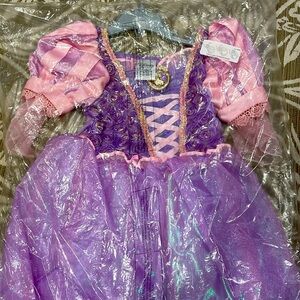 Disney princess Rapunzel dress. Size 3. Brand new. Never removed from bag.